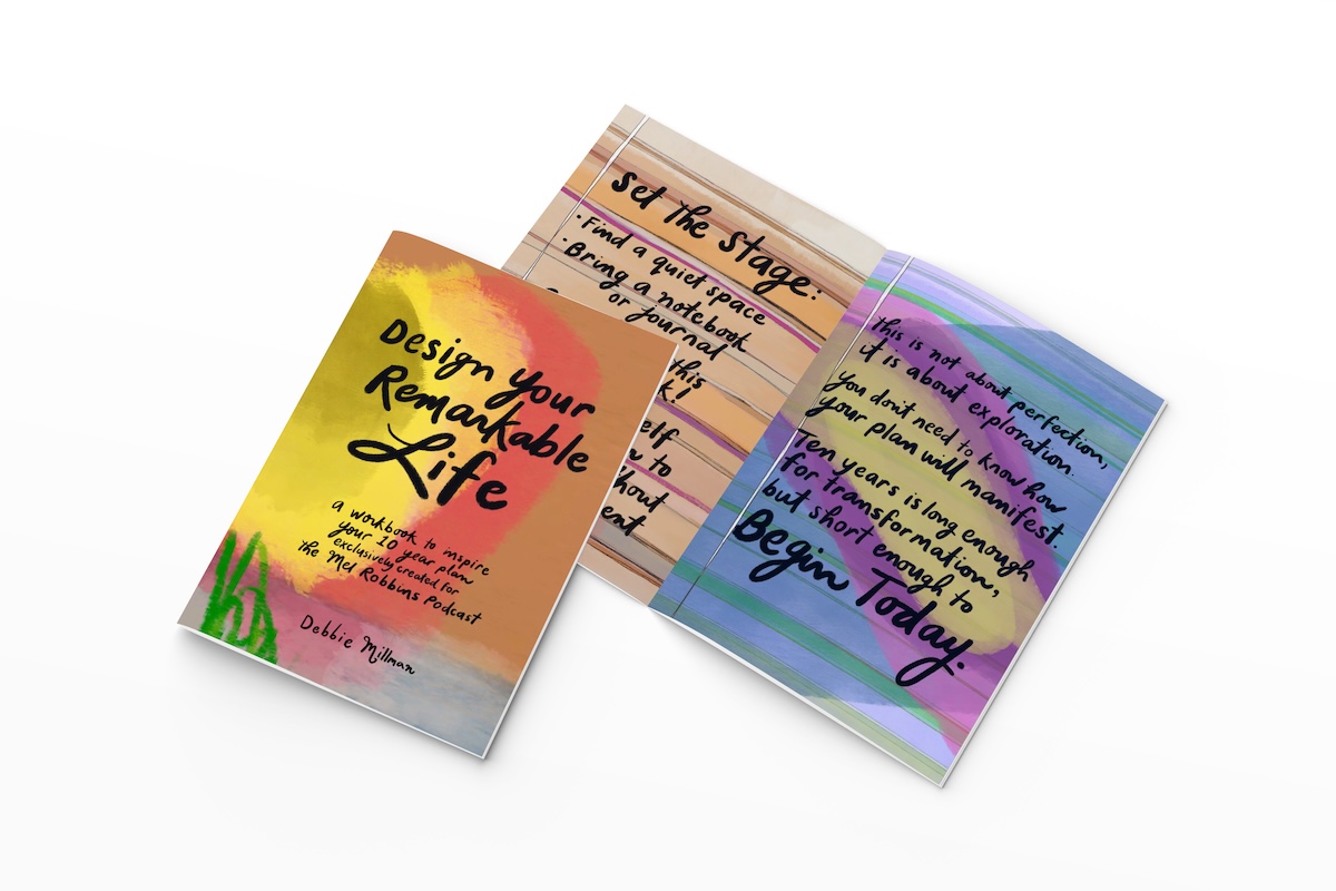 Design your life workbook by Mel Robbins and Debbie Millman sitting open on white background
